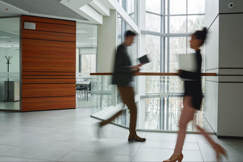 Busy office workers in a high-rise building within a bustling urban environment