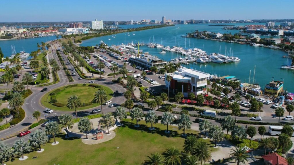 Tourists enjoying Clearwater’s bustling Pier 60 with nearby shops and attractions