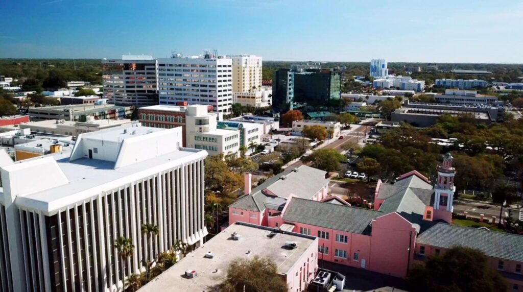 Street view of Downtown Clearwater featuring retail shops and pedestrians