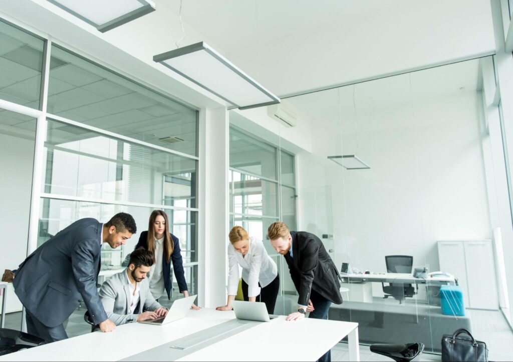 Team of professionals working together in a modern Clearwater office space