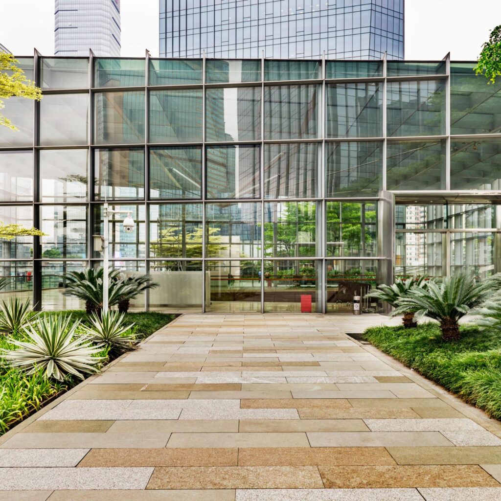 Contemporary office building in Land O’ Lakes with sleek glass windows, green surroundings, and professional appeal, representing the area's expanding business sector.