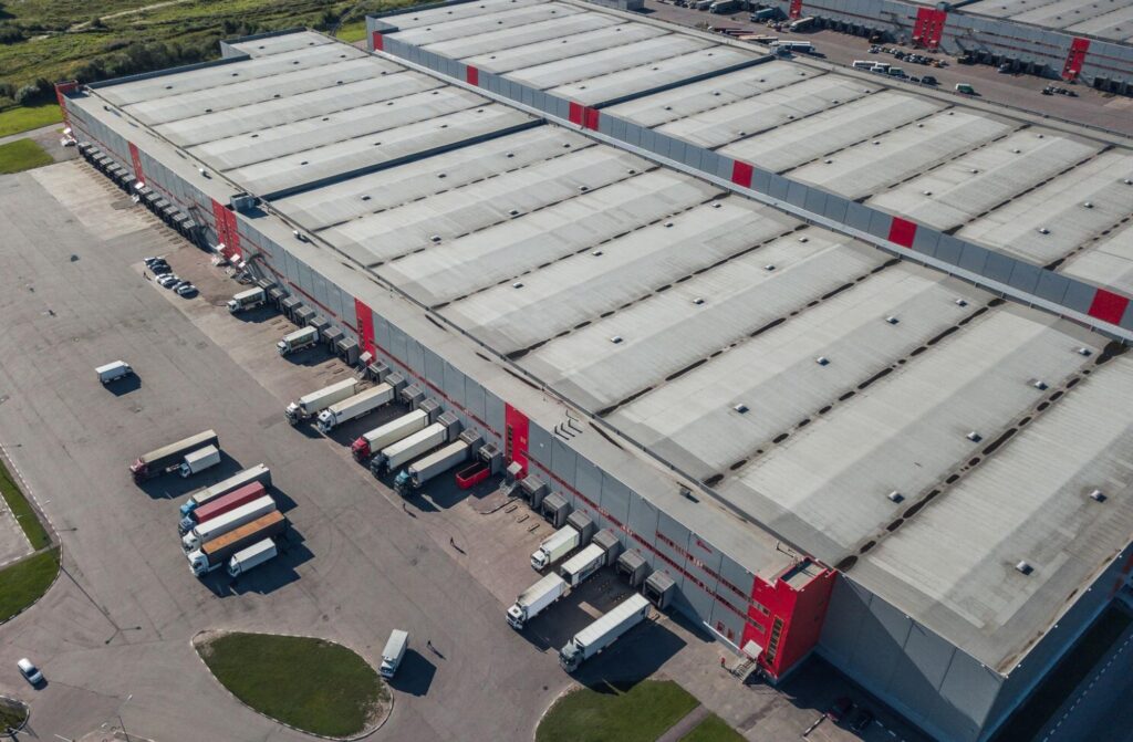 Logistics hub in Thonotosassa with semi-trucks at a warehouse loading dock, highlighting the area's growing distribution sector.